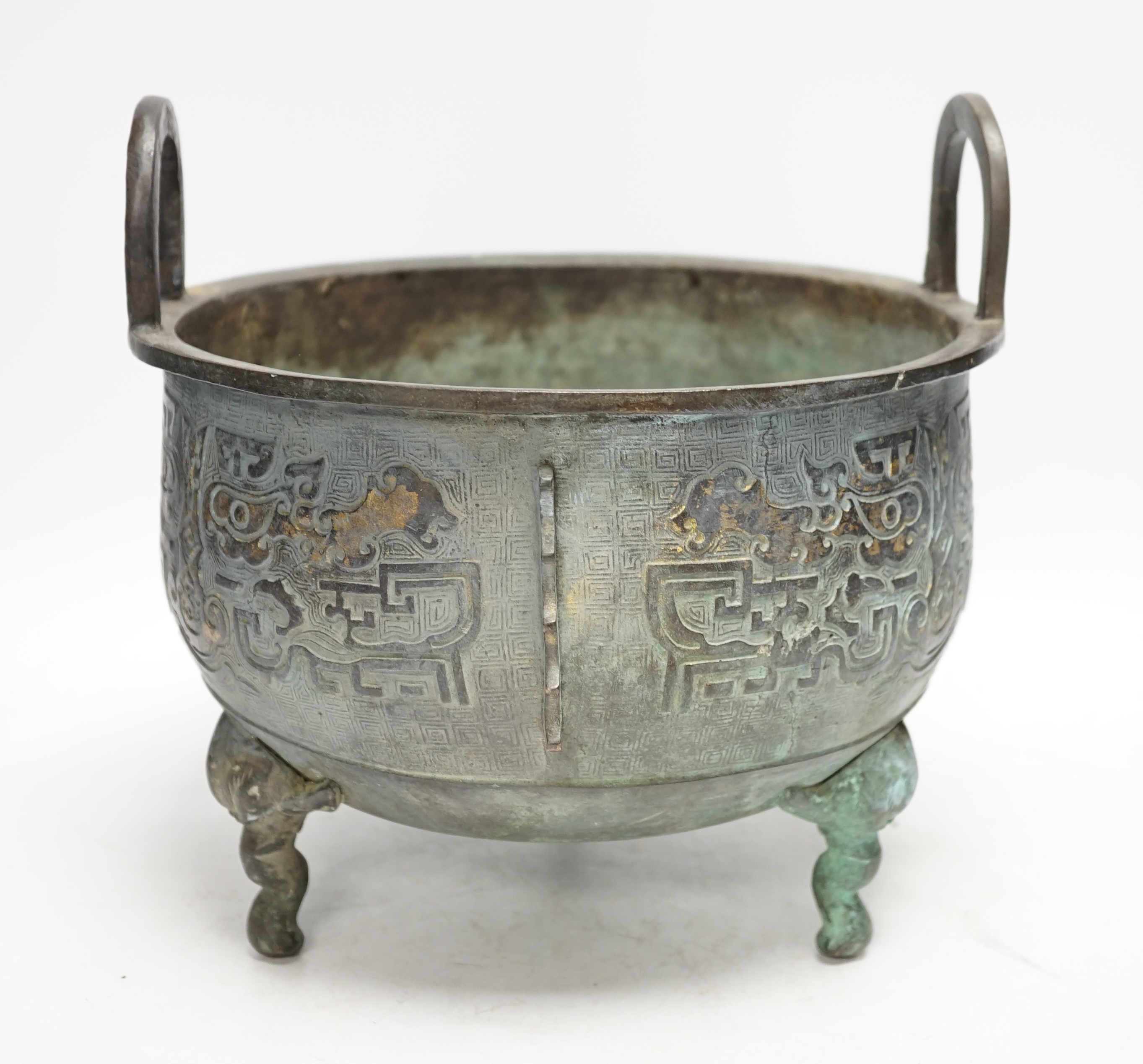 A large Chinese parcel gilt bronze tripod censer, 24.5cm high, 25cm diameter. Condition - fair